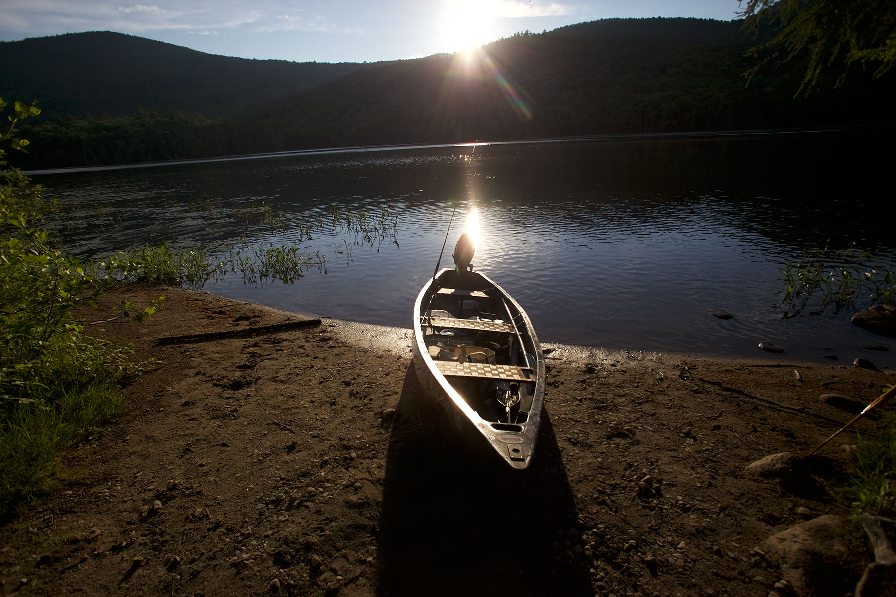 Canoe-on-Upstate-NY-Lake-in-setting-sun
