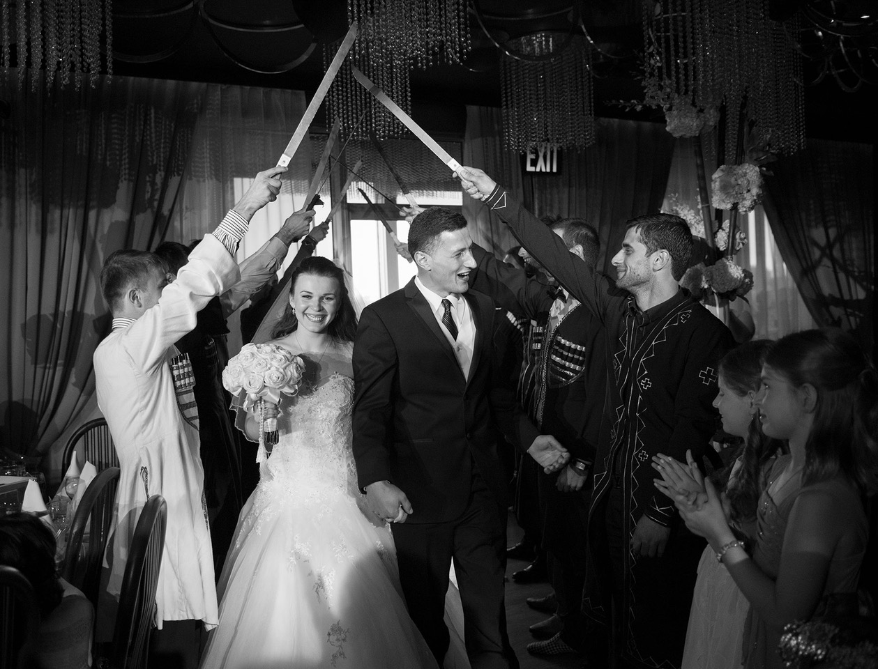 Kate-smiling-with-swords-at-wedding