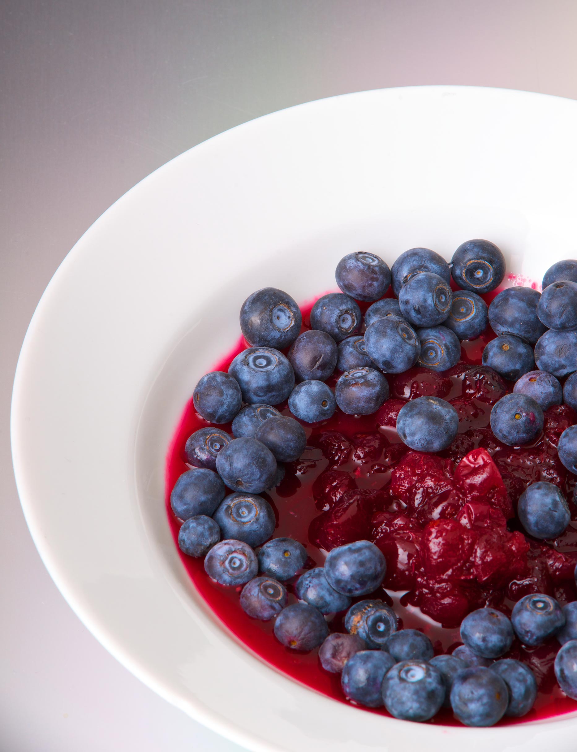 white ceramic bowl with fresh blueberries and cranberries.jpg