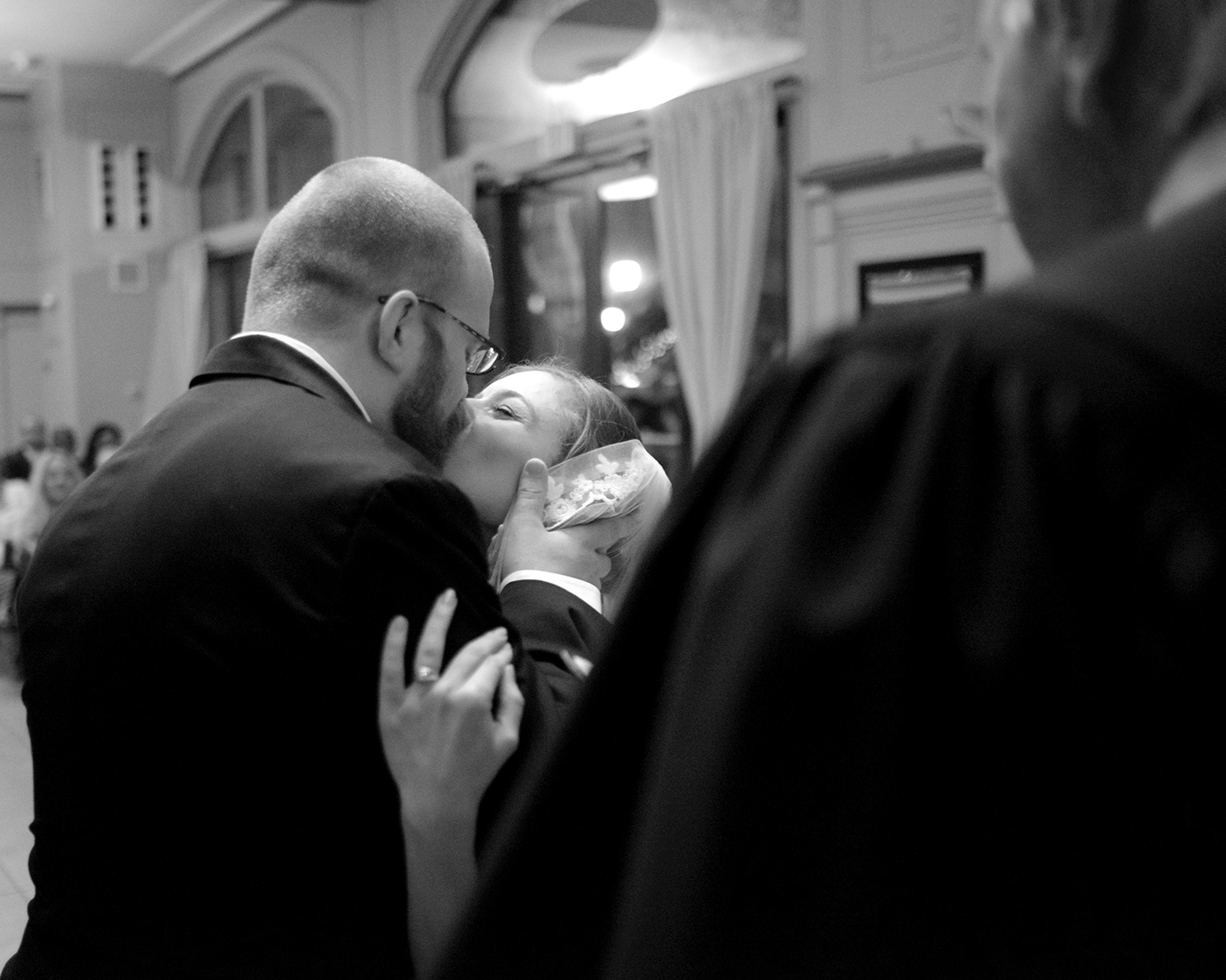 Savannah Bride kissing the groom at Wedding ceremony.