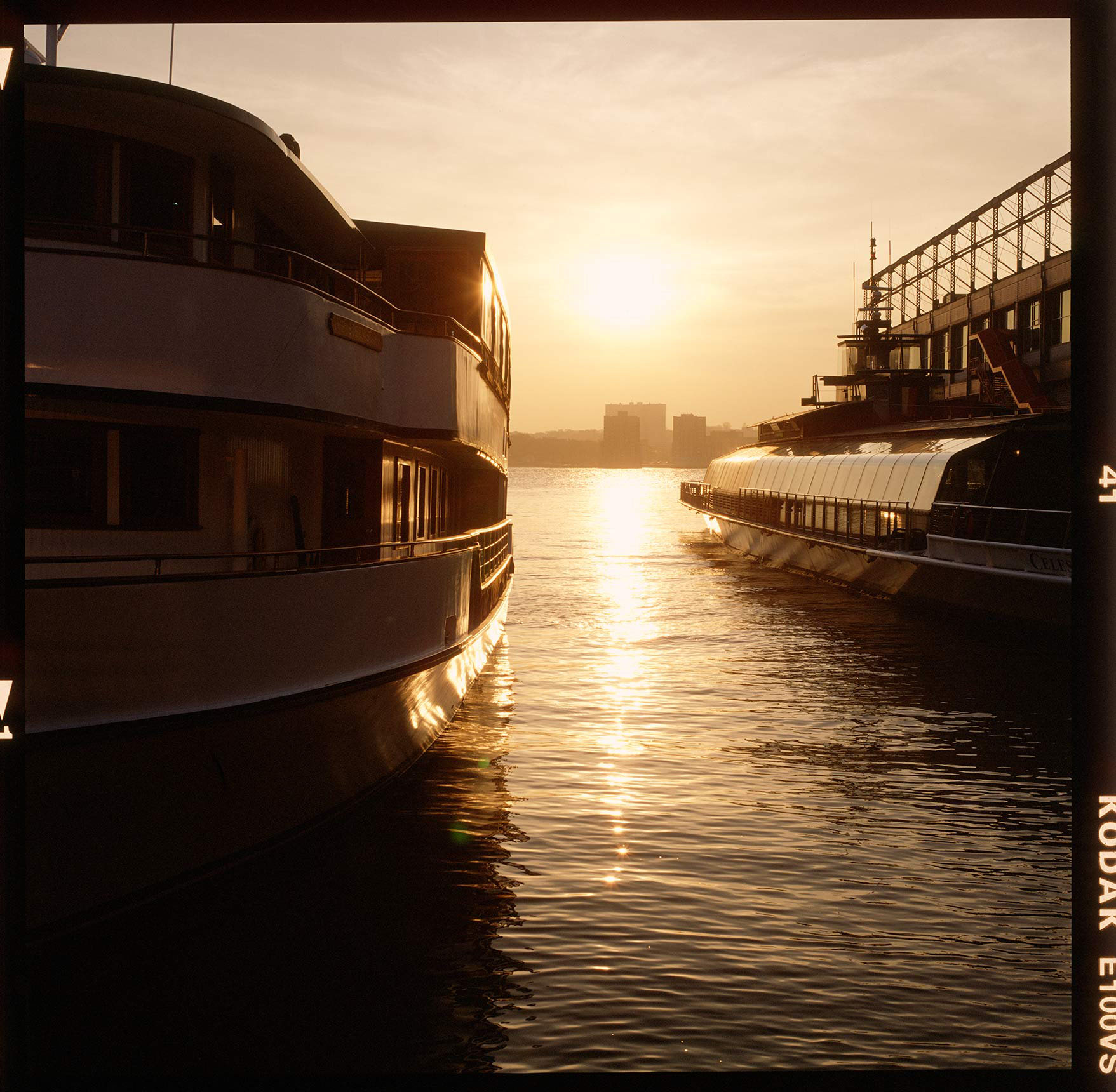 cruise-boats-along-pier-on-hudson-river-at-sumset