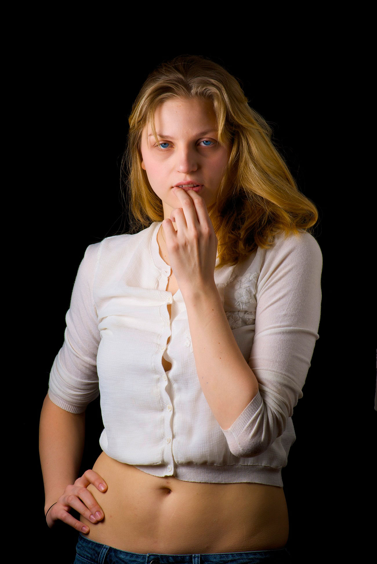 A young model  in studio getting a headshot for portfolio.